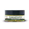 Namastasyai Pain Relief Balm in a clear plastic jar with a black lid and a green and yellow label, shown on a white background with a soft shadow.