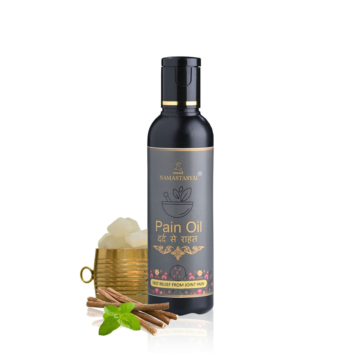 A bottle of Namastasyai Pain Oil with a black cap and dark gray label, shown alongside a gold cup filled with white ghee, cinnamon sticks, and mint leaves on a white background.